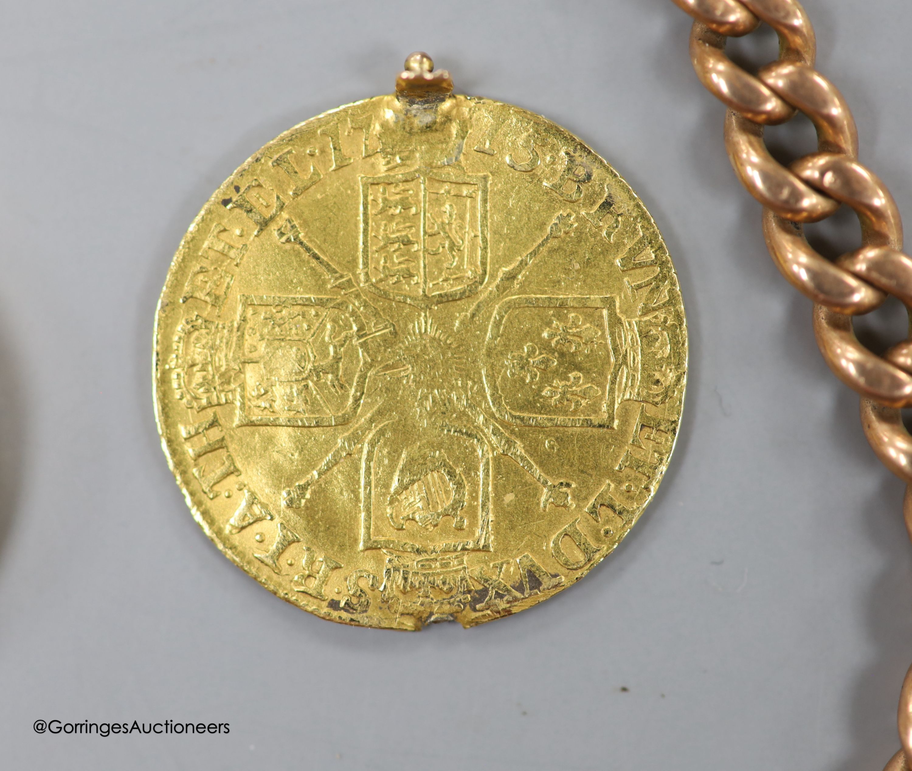 An Edwardian 9ct albert chain, 37.5cm, 33.3 grams. hung with a yellow metal and bloodstone and gold coin set locket charm, gross weight 8 grams.